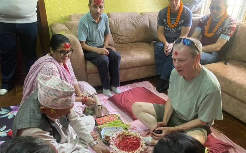 tourist celebrating tika ceremony during dashain